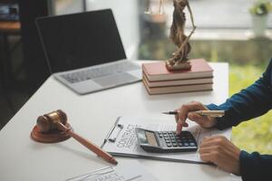 Lawyer, legal advisor, businessman brainstorming information on agreement details Business contracts in legal processing books for accuracy in contract documents. joint financial investment. photo