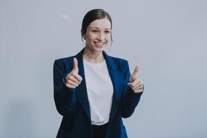 Successful young asian businesswoman in suit ready do business, cross arms confident and smiling. Female entrepreneur determined to win. Happy saleswoman talking to clients, white background photo