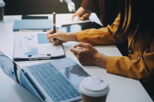 Financial Business team present. Business man hands hold documents with financial statistic stock photo, discussion, and analysis report data the charts and graphs. Finance Financial concept photo