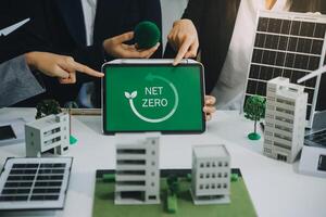Carbon offset price report CO2 emission. Future growth Net zero waste in ESG ethical SME office protect climate change global warming social issues project. Group of asia people Eco friendly SDGs plan photo