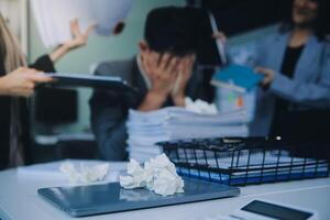 Stressful business man have so many paperwork in the office photo