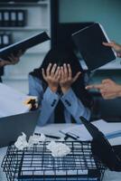 Stressful business man have so many paperwork in the office photo