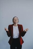 Happy young businesswoman on white background photo