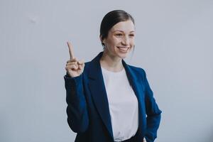 Successful young asian businesswoman in suit ready do business, cross arms confident and smiling. Female entrepreneur determined to win. Happy saleswoman talking to clients, white background photo