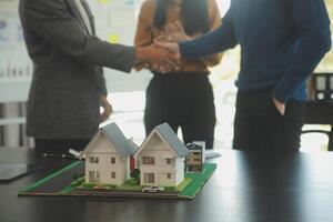 Team of architectures and businessmen discussing and brainstorming on floor plan modification for real estate investment and housing development project photo