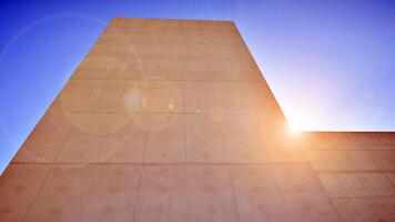 Sunlight and shadow on surface of white Concrete Building wall against blue sky background, Geometric Exterior Architecture in Minimal Street photography style photo