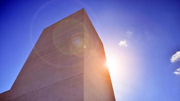 Sunlight and shadow on surface of white Concrete Building wall against blue sky background, Geometric Exterior Architecture in Minimal Street photography style photo