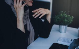 Shot of an attractive mature businesswoman working on laptop in her workstation. photo