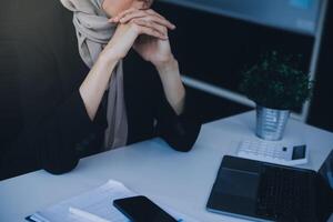 Shot of an attractive mature businesswoman working on laptop in her workstation. photo