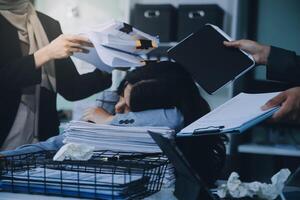 Stressful business man have so many paperwork in the office photo