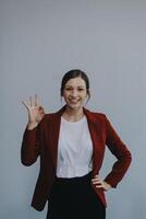 Happy young businesswoman on white background photo