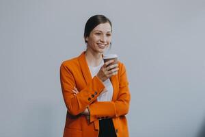 Business woman portrait with cup , isolated. Female model with long hair. photo