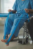 A physiotherapist doing treatment with patient in bright office photo