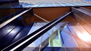 Steel and glass. The subject of modern architecture or construction industry. Modern office building facade with tall steel construction elements and full height windows between. photo