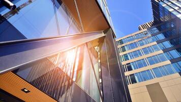 Steel and glass. The subject of modern architecture or construction industry. Modern office building facade with tall steel construction elements and full height windows between. photo