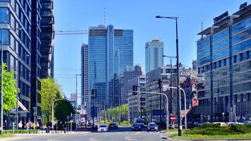 Warsaw, Poland. 11 April 2024. Car traffic at rush hour in downtown area of the city. City center with cars and buildings in the background. photo
