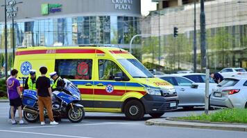 Warsaw, Poland. 11 April 2024. Police and ambulance at the scene. Rescue vehicles on the site of a car accident. photo