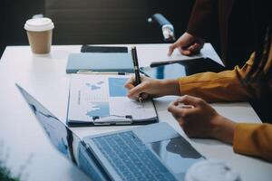 Financial Business team present. Business man hands hold documents with financial statistic stock photo, discussion, and analysis report data the charts and graphs. Finance Financial concept photo
