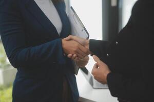 Business handshake for teamwork of business merger and acquisition,successful negotiate,hand shake,two businessman shake hand with partner to celebration partnership and business deal concept photo