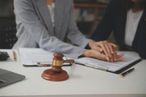Lawyer, legal advisor, businessman brainstorming information on agreement details Business contracts in legal processing books for accuracy in contract documents. joint financial investment. photo