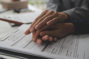 Lawyer, legal advisor, businessman brainstorming information on agreement details Business contracts in legal processing books for accuracy in contract documents. joint financial investment. photo