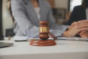 Lawyer, legal advisor, businessman brainstorming information on agreement details Business contracts in legal processing books for accuracy in contract documents. joint financial investment. photo