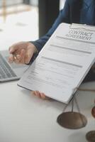 Lawyer, legal advisor, businessman brainstorming information on agreement details Business contracts in legal processing books for accuracy in contract documents. joint financial investment. photo