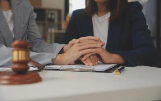 Lawyer, legal advisor, businessman brainstorming information on agreement details Business contracts in legal processing books for accuracy in contract documents. joint financial investment. photo