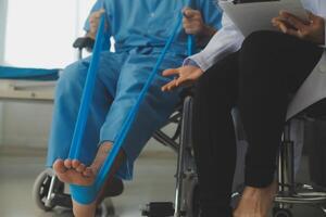 A physiotherapist doing treatment with patient in bright office photo