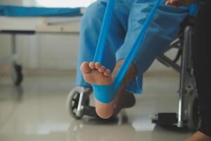 A physiotherapist doing treatment with patient in bright office photo