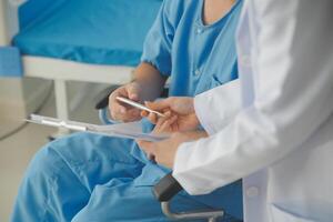 Female doctors who treat patients make an appointment to listen to the results after a physical examination and explain medical information and diagnose the disease. Medical concepts and good healt. photo