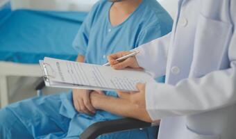 Female doctors who treat patients make an appointment to listen to the results after a physical examination and explain medical information and diagnose the disease. Medical concepts and good healt. photo