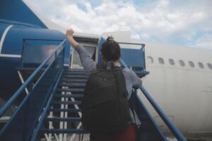 Happy attractive asian woman traveler with backpack at the modern airport terminal, copy space, Tourist journey trip concept photo