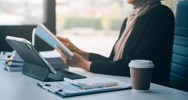 Shot of an attractive mature businesswoman working on laptop in her workstation. photo