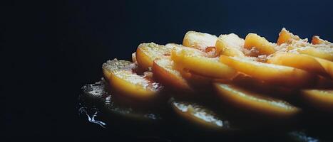 A close up of a delicious looking baked peach tart with a dark background. photo