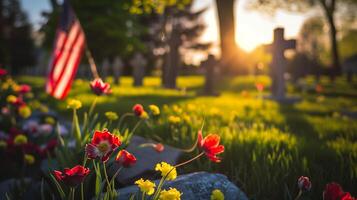 An American flag and flowers decorate a cemetery under sunlight photo