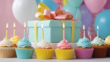 Celebration Cupcakes. Colorful cupcakes with lit candles displayed against a backdrop of wrapped gifts. Captured indoors during a birthday celebration photo