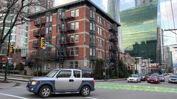 streets of Canada skyscrapers people cars life in big city traveling to Vancouver beautiful city best in world to live very expensive metropolis houses offices hotels city center Vancouver Canada 2023 video