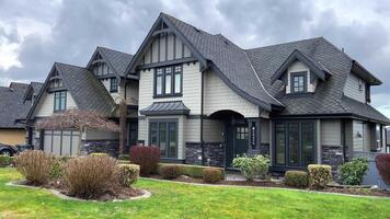 beautiful new house in city of Surrey near Vancouver Canada private sector no people clouds picture like from visualization magazine desire to have such mansion street trees built two-story cottage video