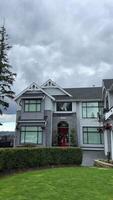 beautiful new house in city of Surrey near Vancouver Canada private sector no people clouds picture like from visualization magazine desire to have such mansion street trees built two-story cottage video