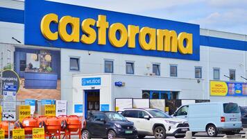 Warsaw, Poland. 28 April 2024. Signboard with brand logo of Castorama home improvement retailer and building supplies store. photo