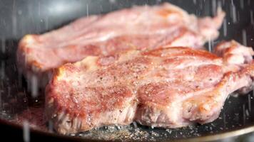 Searing fillet steaks in a frying pan video