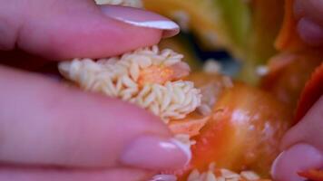 Sweet and red bell peppers, sliced with a knife on a board, sunny cloudless day. Dolly macro video