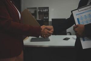 Business handshake for teamwork of business merger and acquisition,successful negotiate,hand shake,two businessman shake hand with partner to celebration partnership and business deal concept photo