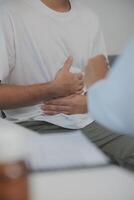 Man suffering with severe stomach pain sitting at home. Hand of mature guy holding abdomen suffering from ache, diarrhea or indigestive problem. Caucasian guy pressing on belly on painful sensation photo