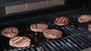 Hamburgers cooling on flaming grill, slow motion. Shot on Phantom Flex 4K camera. video