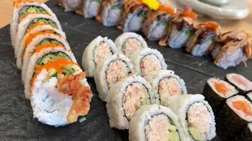 ROLL COMBO, California Roll, Dynamite Roll, Tuna Maki, Salmon Maki slow motion side close up video