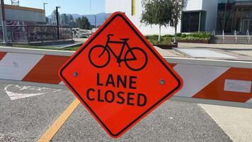 Lane closed sign on the road not allowing bicycles to pass Passage prohibited barrier construction vancouver canada video