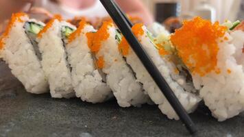 ROLL COMBO, California Roll, Dynamite Roll, Tuna Maki, Salmon Maki slow motion side close up video