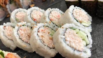 ROLL COMBO, California Roll, Dynamite Roll, Tuna Maki, Salmon Maki slow motion side close up video